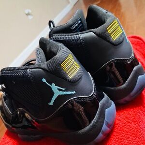 Jordan Retro 11 Gamma Black with Teal Jumpman and Yellow/gold Accents